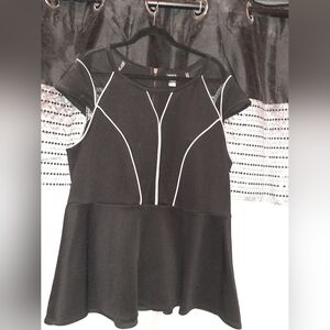 Torrid Black Peplum with mash cutouts.